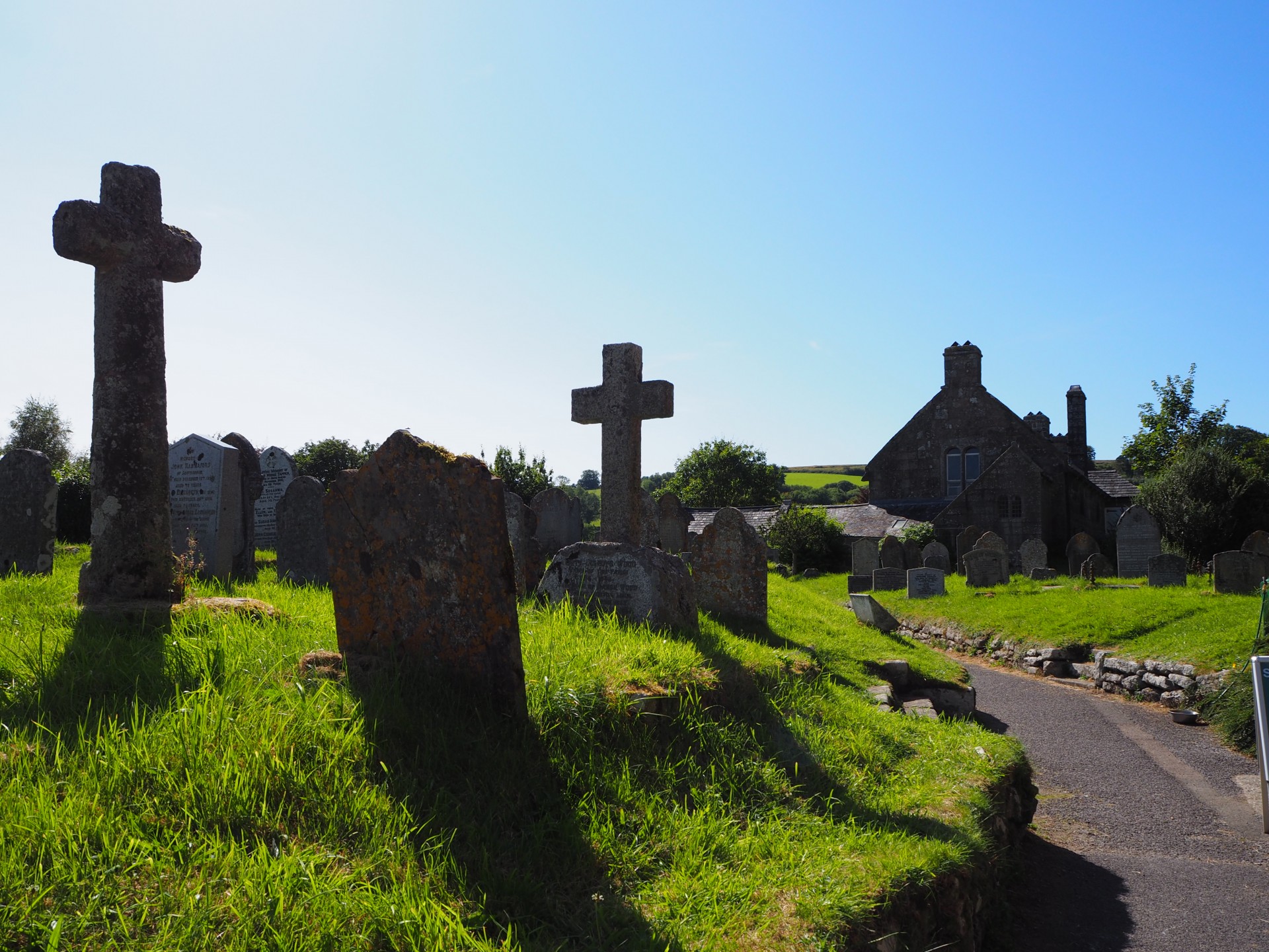 Behind the churchyard.